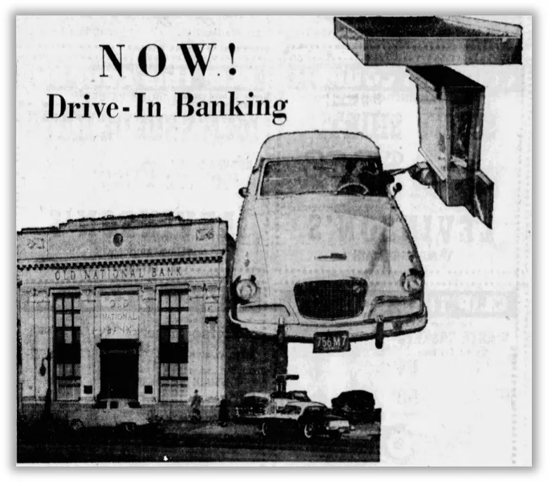 A 1956 black and white advertisement from the Evansville Courier and Press shows a cut out photo of Old National Bank, over top is spliced a cut out photo of a car driver reaching toward a drive through window. The photo is captioned ‘NOW! Drive-In Banking’